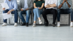 job candidates waiting in chairs in lobby before an interview