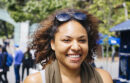 Smiling woman walking on campus