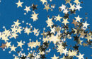 gold confetti stars on blue background