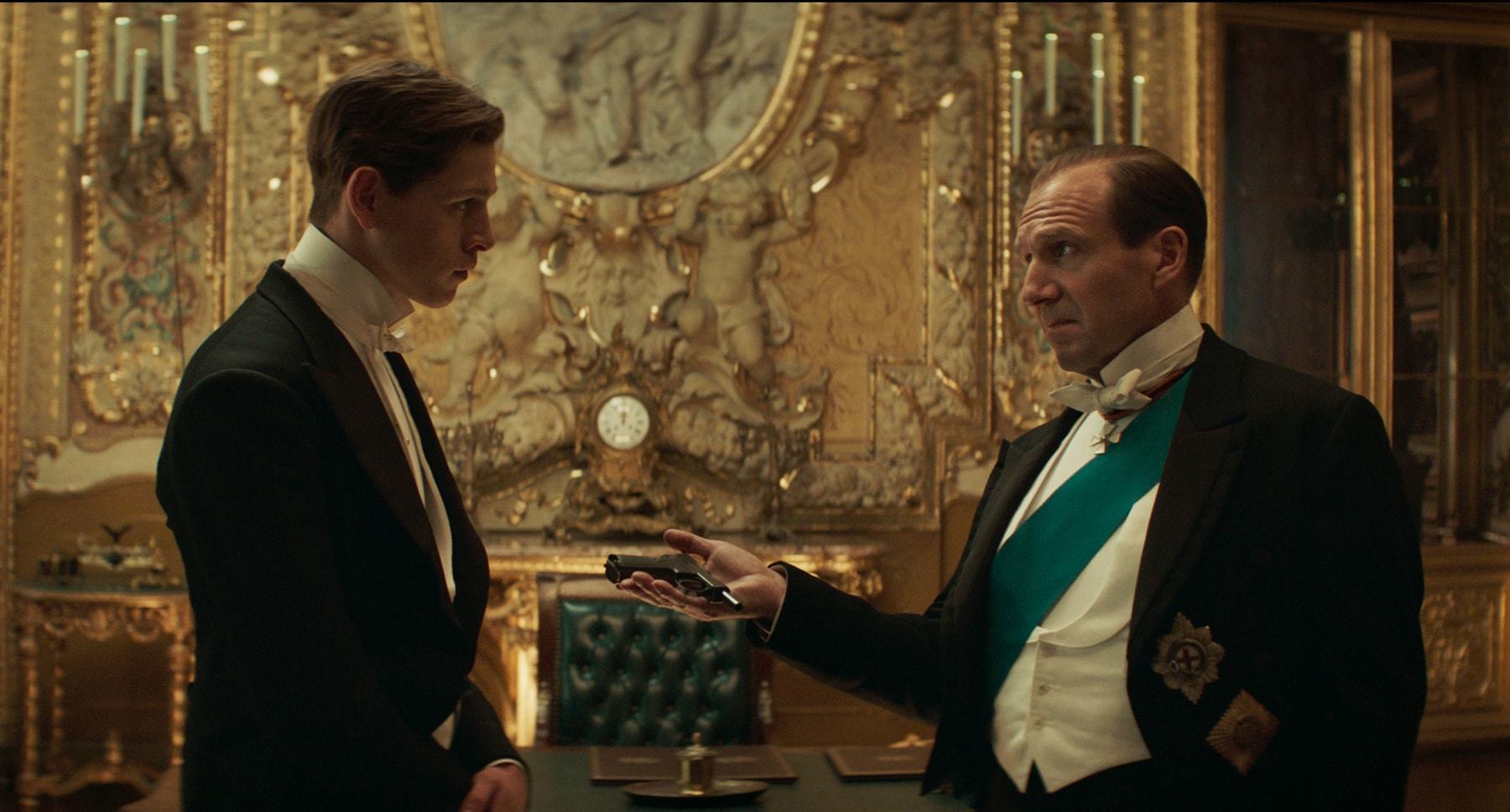 (L-R) Harris Dickinson as Conrad and Ralph Fiennes as Oxford in 20th Century Studios' THE KING'S MAN. Photo Credit: Courtesy of 20th Century Studios. © 2020 Twentieth Century Fox Film Corporation. All Rights Reserved.