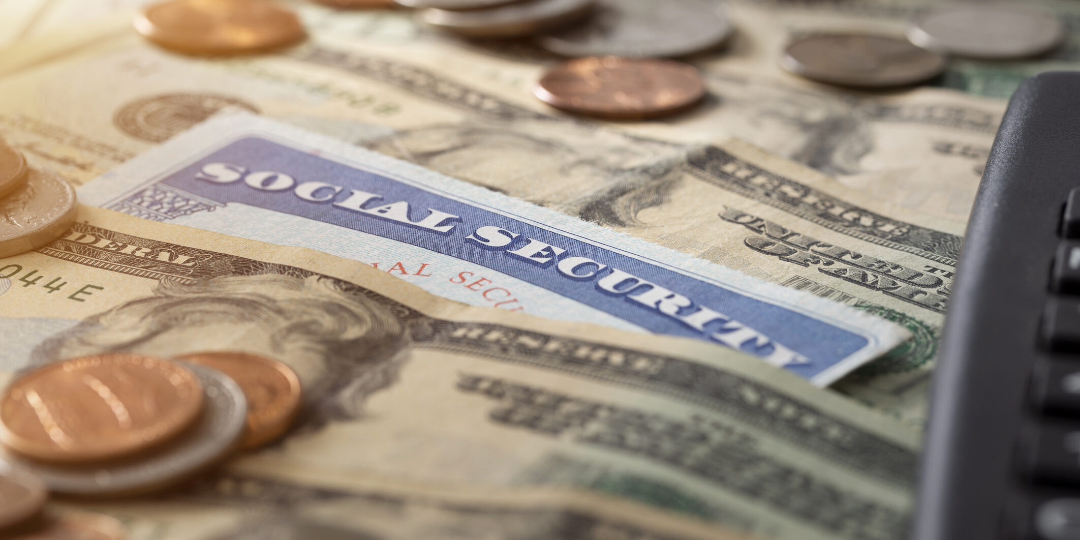 A social security card and pile of money.