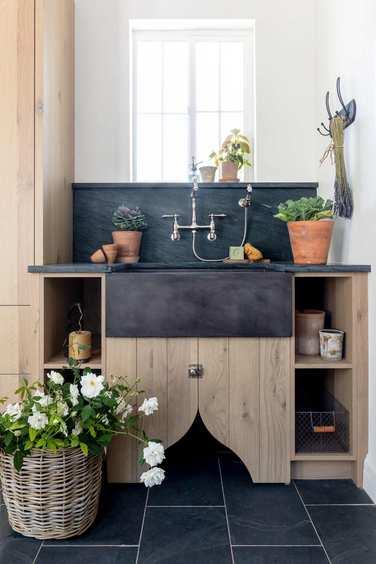 Modern farmhouse mudroom concrete sink flowers in a basket