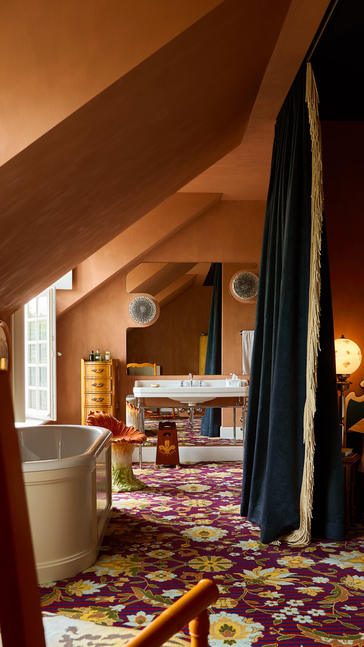 Bedroom suite with carpet. Bathtub and sink are also in the room