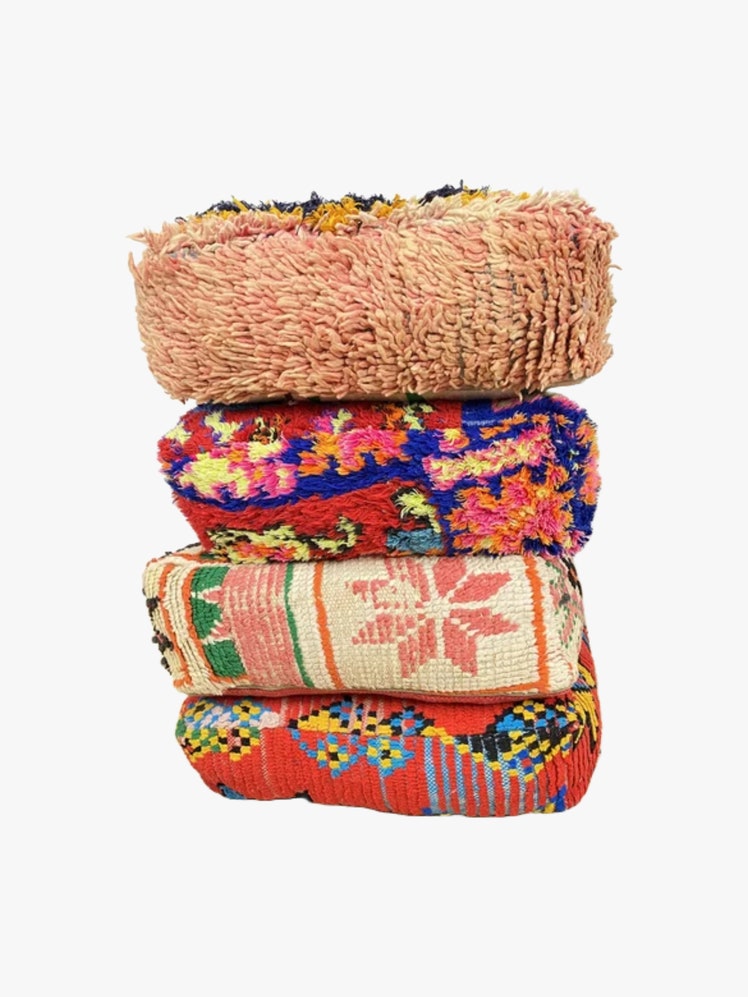 Stack of colorful Moroccan Kilim Poufs.