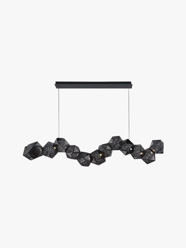 Pendant light made up of a string of black perforated geometric shades with bulbs inside.