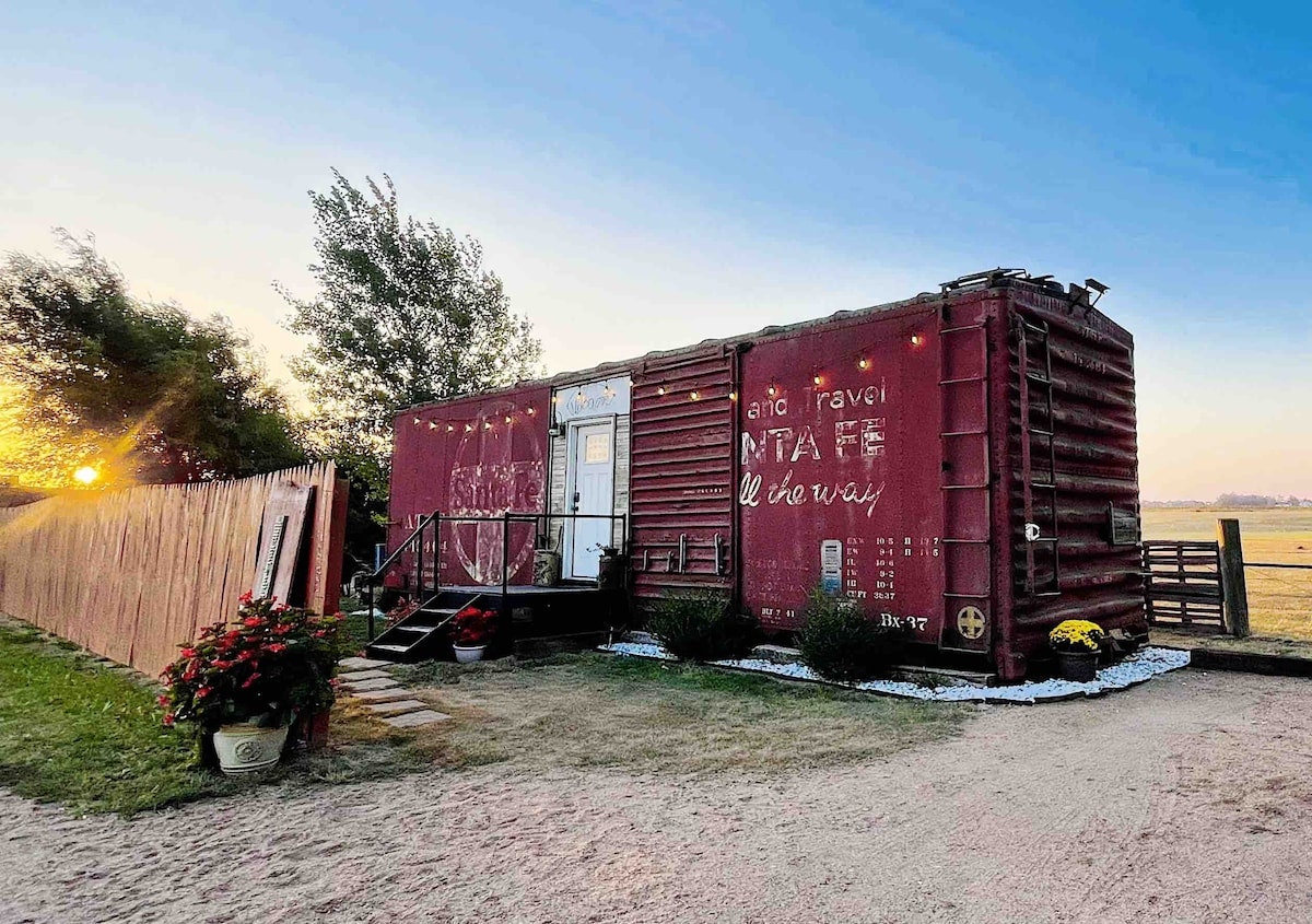 Exterior of a boxcar converted into an Airbnb in Hutchinson Kansas.