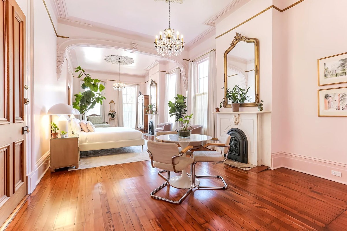 Interior of a New Orleans studio apartment with historical details.