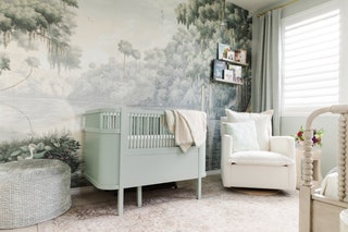 graysage wallpaper with scene of large trees Spanish moss light sage crib large gray ottoman to left white chair beneath...