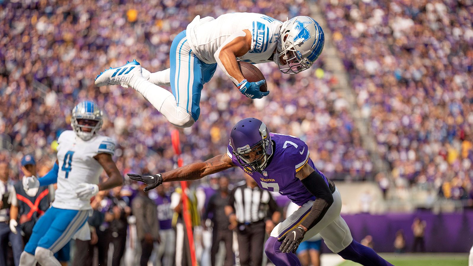 Who knew Lions could fly? Detroit wide receiver Amon-Ra St. Brown soars over Minnesota Vikings cornerback Patrick Peterson to pick up a first down at the two-yard line in the first quarter of their Week 3 clash. The Vikings won the game, 28-24, led by Kirk Cousins' 260 yards passing and two TD tosses, to go to 2-1 on the year.