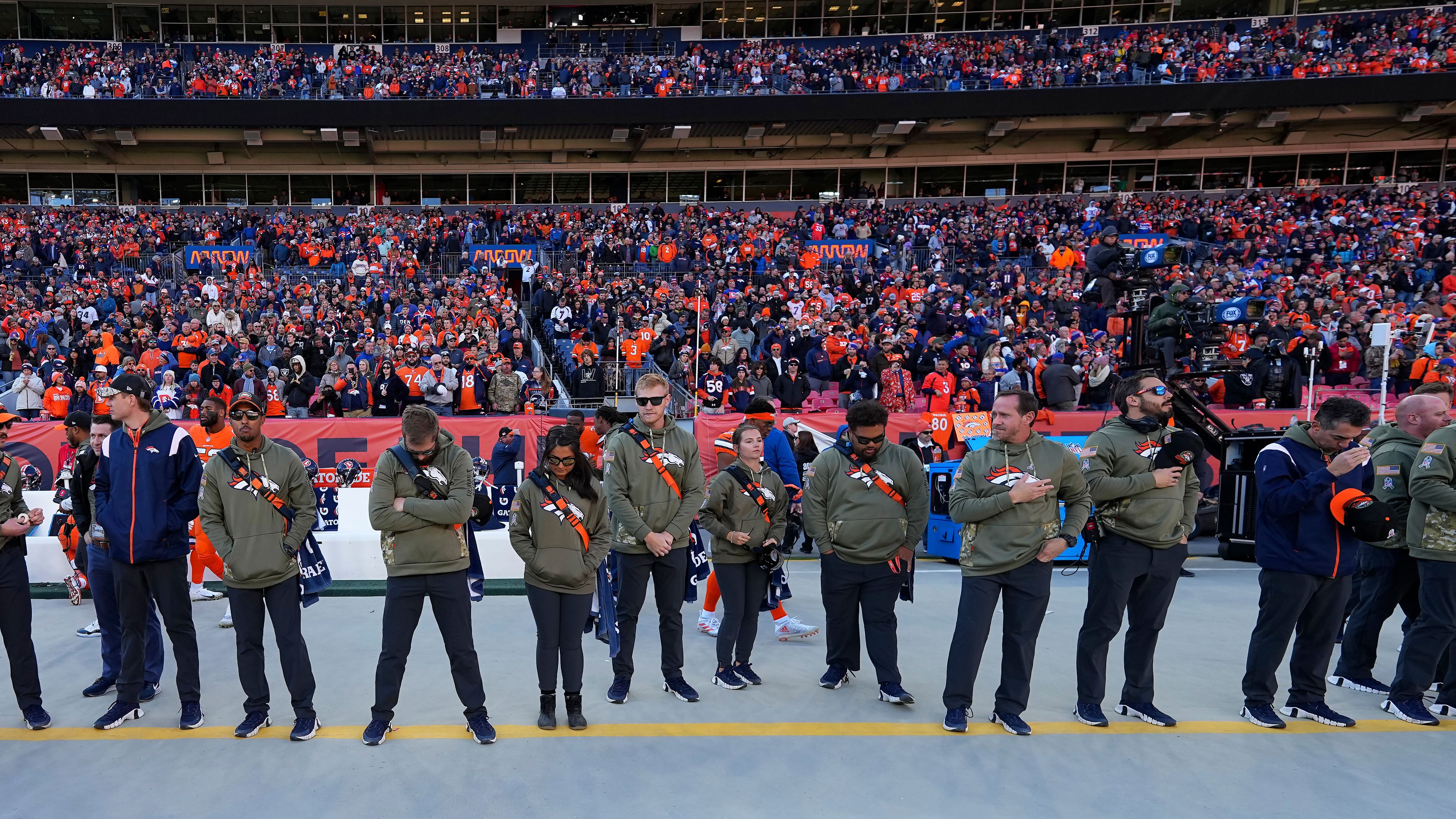 Ahead of their game against the Las Vegas Raiders on November 20, Denver Broncos staff members and fans observe a moment of silence for victims of <a href="https://www.cnn.com/2022/11/20/us/gallery/colorado-lgbtq-club-shooting/index.html" target="_blank">an attack at a Colorado Springs LGBTQ nightclub</a> late Saturday. A gunman entered the Club Q nightclub and opened fire, killing at least 5 people and injuring 19 others, police said.