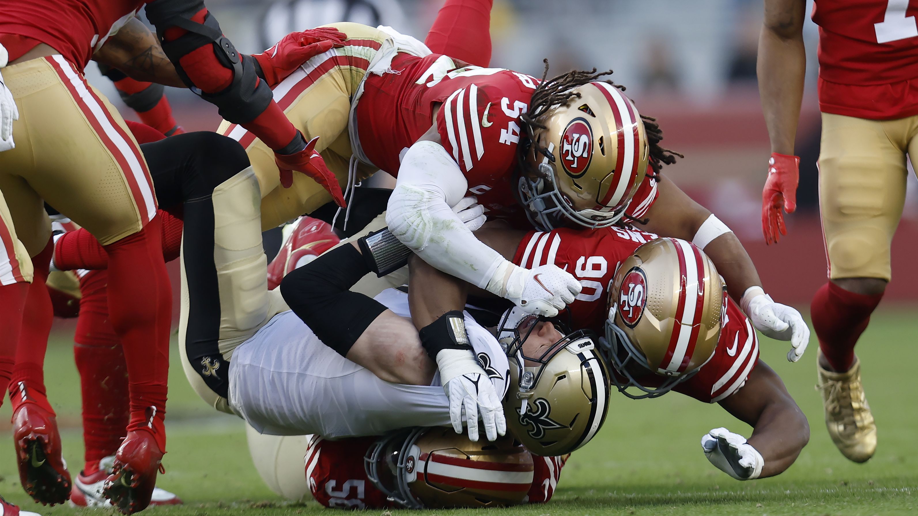 New Orleans Saints tight end Taysom Hill is tackled by San Francisco 49ers defensive end Samson Ebukam, linebacker Fred Warner and defensive tackle Kevin Givens in the second half on November 27. The 49ers would go on to shut out the Saints 13-0 to move to 7-4 on the year.