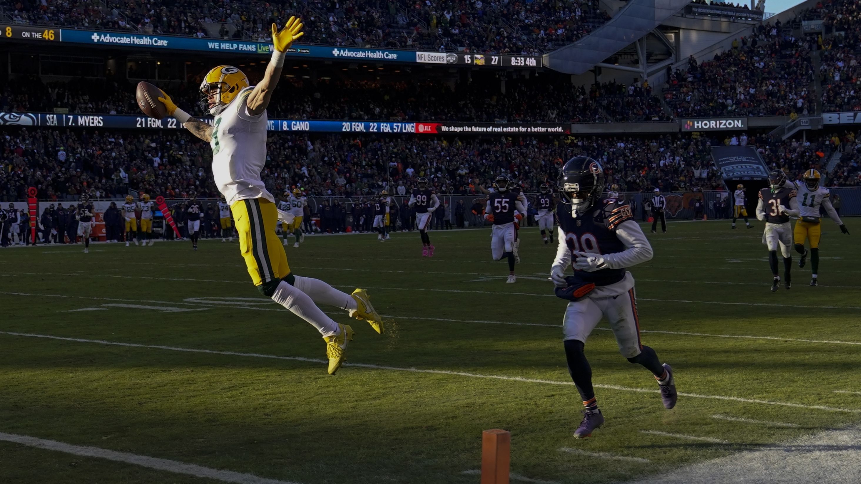 Green Bay Packers' Christian Watson celebrates as he crosses the goal line after catching a touchdown pass from Aaron Rodgers during the second half of a game against the Chicago Bears on December 4. Watson had two touchdowns in the Packers' 28-19 victory over the Bears.