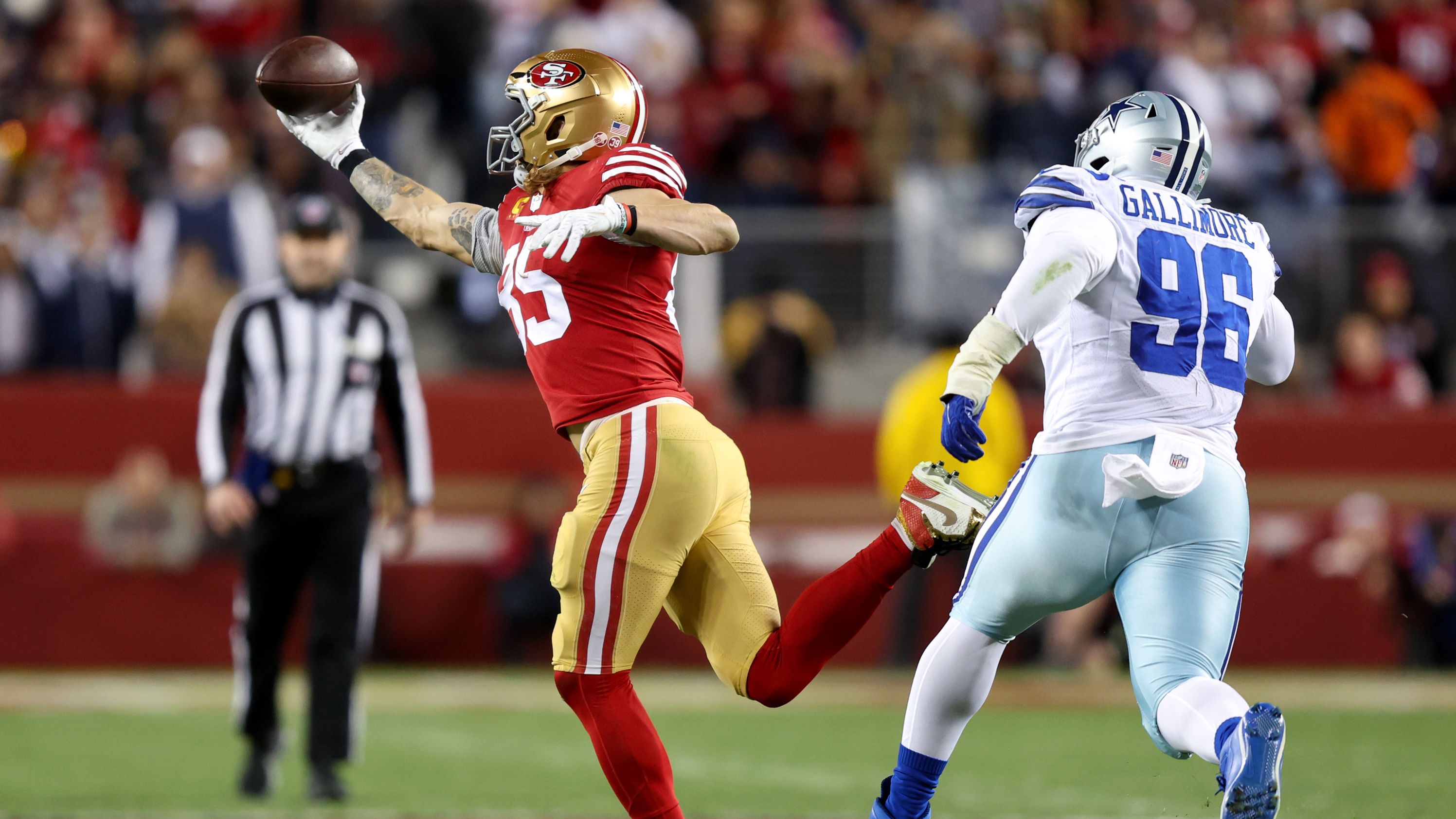 George Kittle of the San Francisco 49ers catches a pass against the Dallas Cowboys during the third quarter. The 49ers' defense -- which picked off Cowboys quarterback Dak Prescott twice -- helped stymie Dallas in a 19-12 victory to move San Francisco to the NFC Championship game.