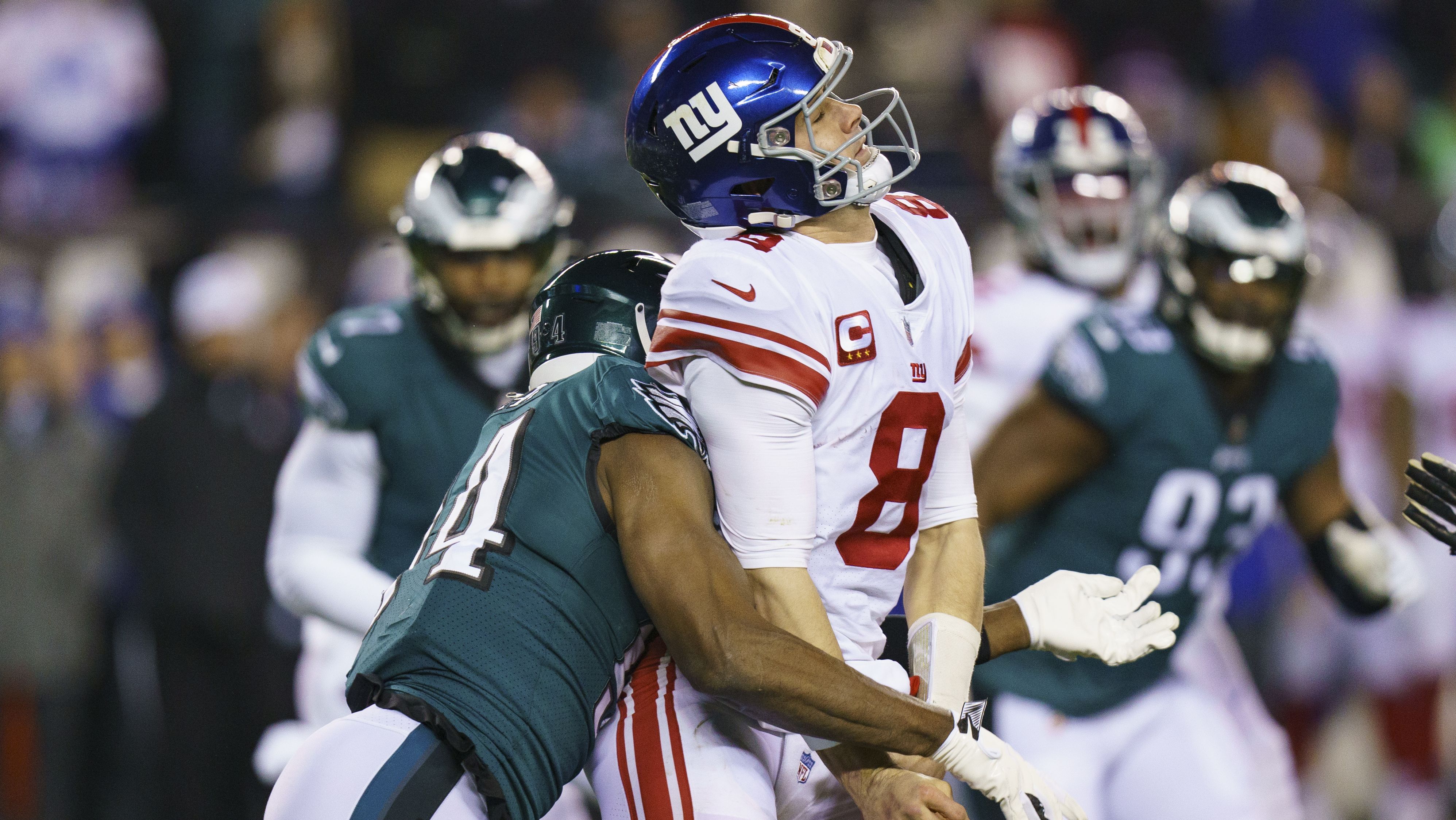 New York Giants quarterback Daniel Jones loses the ball while under pressure by Philadelphia Eagles defensive end Josh Sweat. The Eagles thoroughly dominated the Giants, winning 38-7, to advance to play the 49ers in the NFC Championship game. 