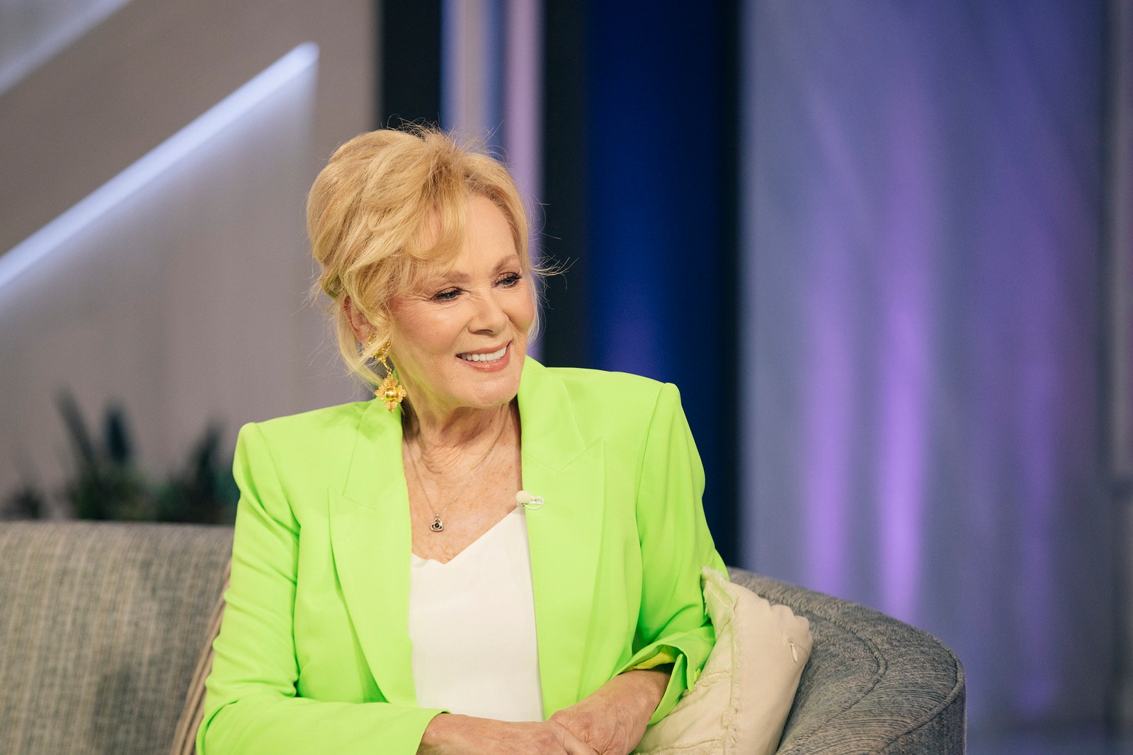 Jean Smart neon green blazer updo couch