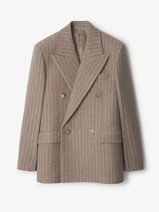 Image may contain Blazer Clothing Coat Jacket Formal Wear and Suit