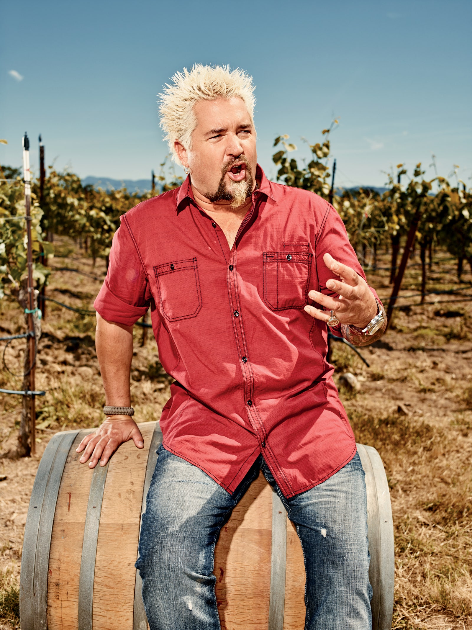 This image may contain Guy Fieri Nature Outdoors Countryside Rural Farm Vineyard Human and Person