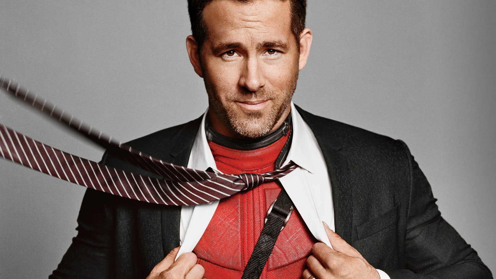 Image may contain Accessories Tie Accessory Ryan Reynolds Clothing Overcoat Suit Apparel Coat Human and Person