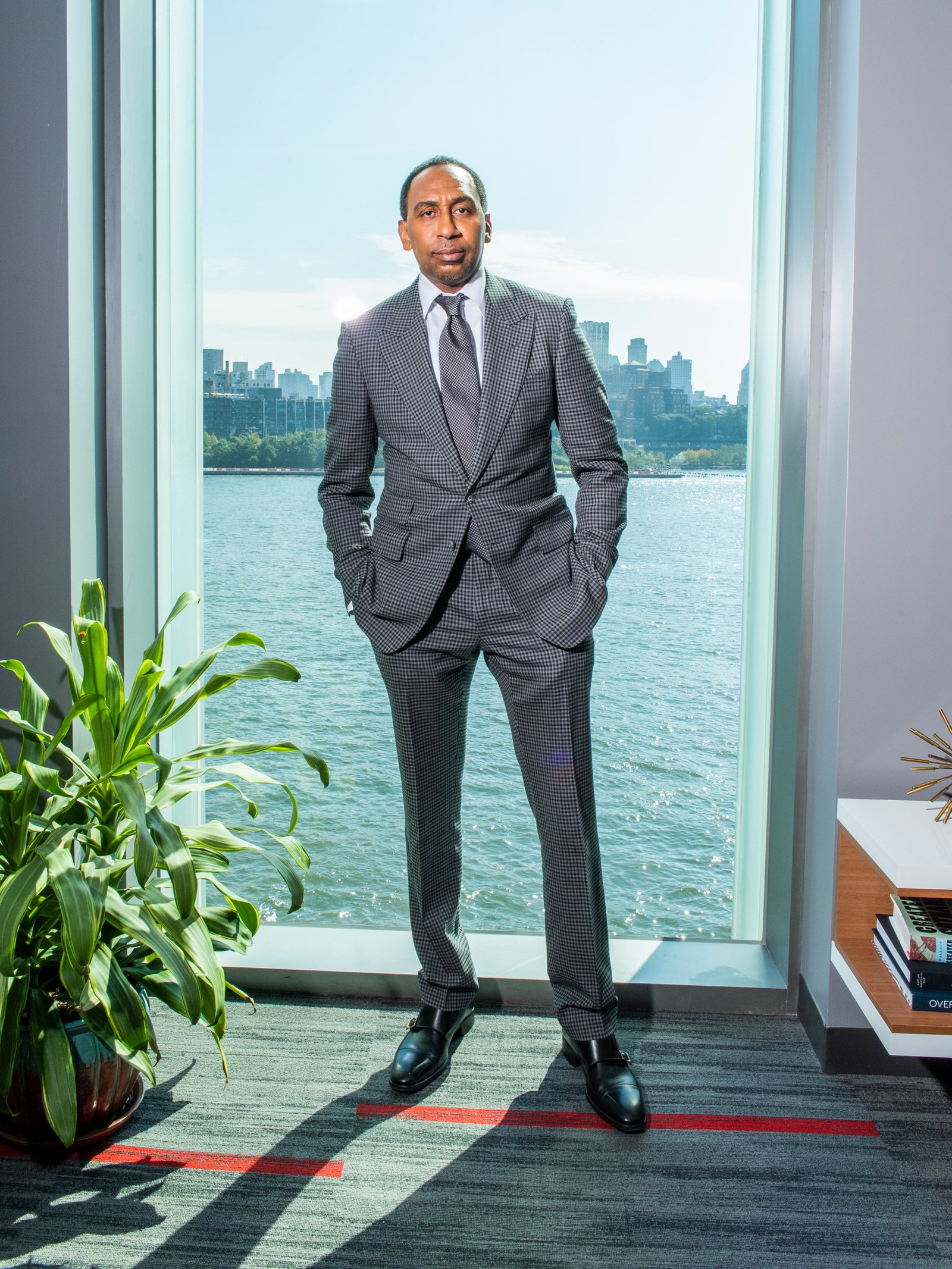 Image may contain Stephen A. Smith Coat Clothing Suit Overcoat Apparel Human and Person