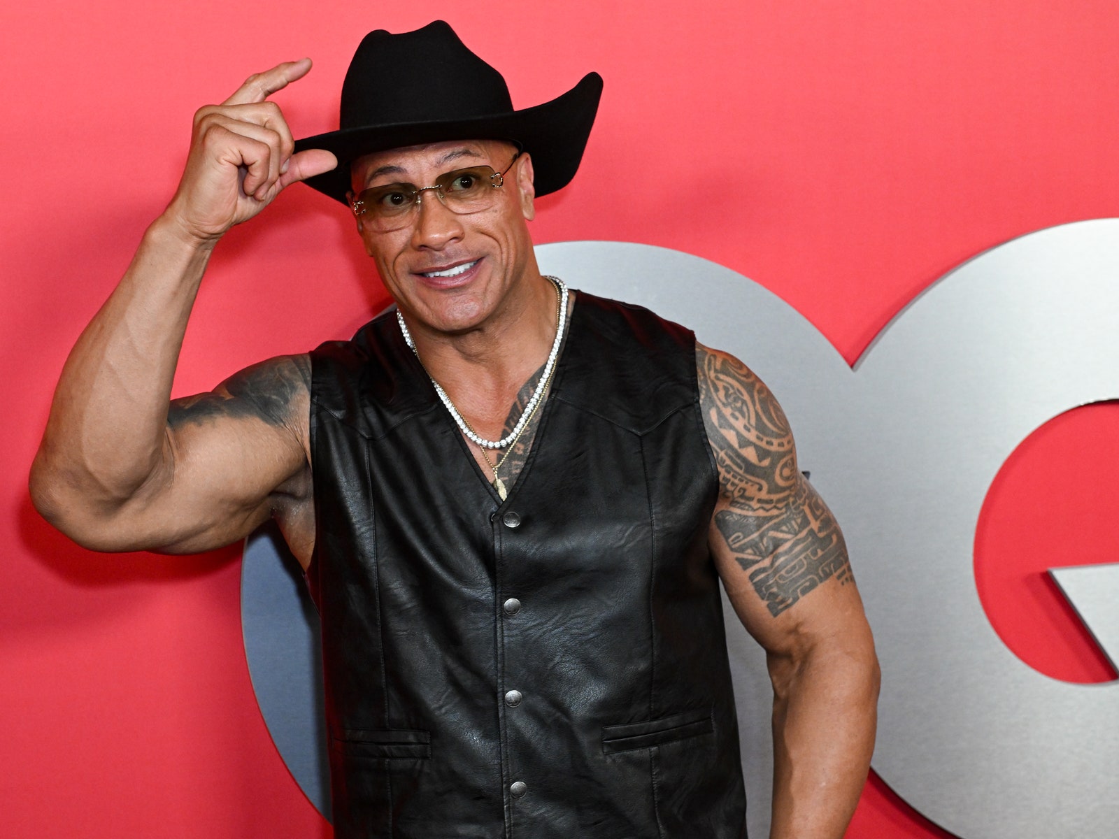 The Rock Brought Back His Most Iconic WWE Look for the GQ Men of the Year Party 2024