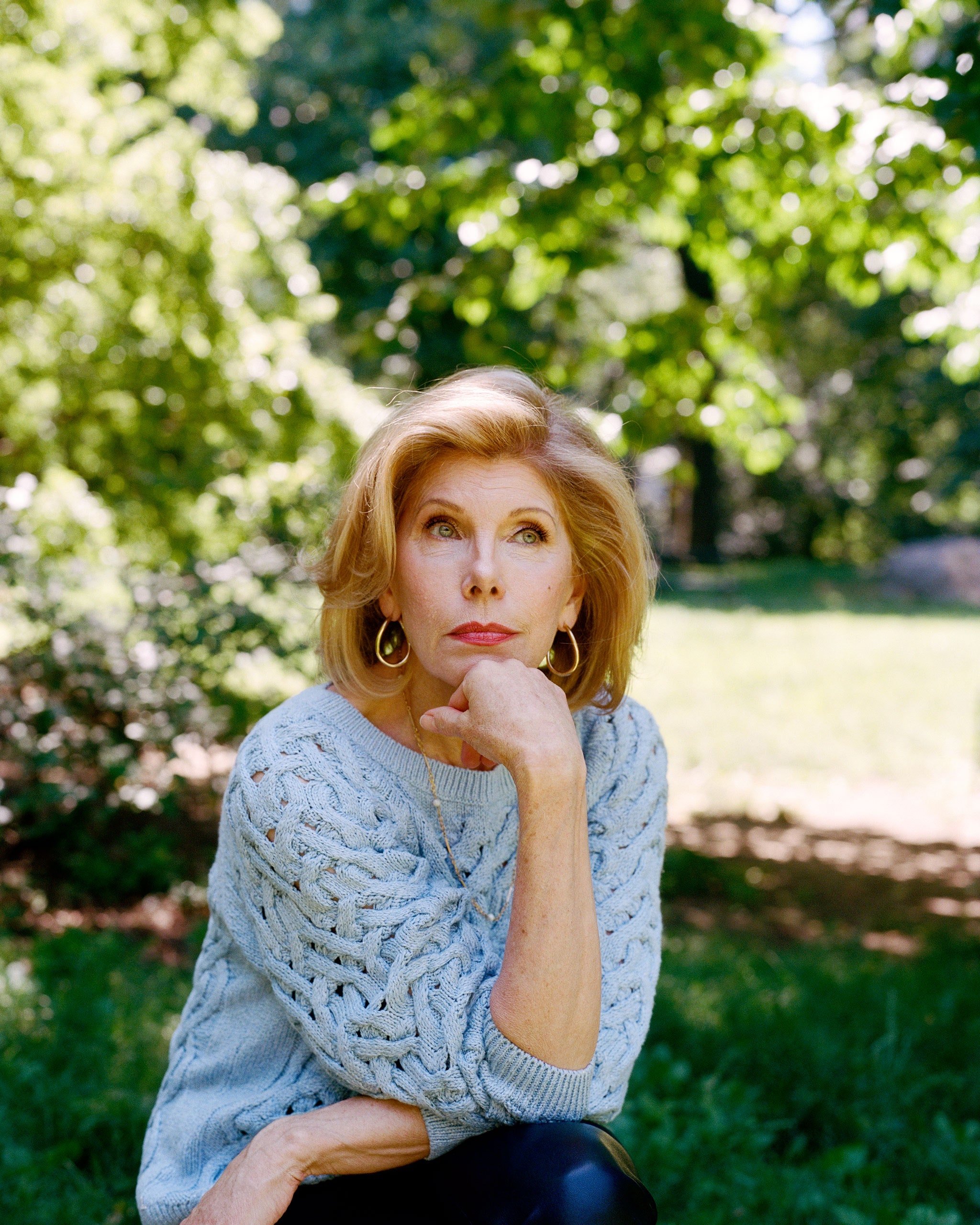 Christine Baranski holding a hand up to her chin