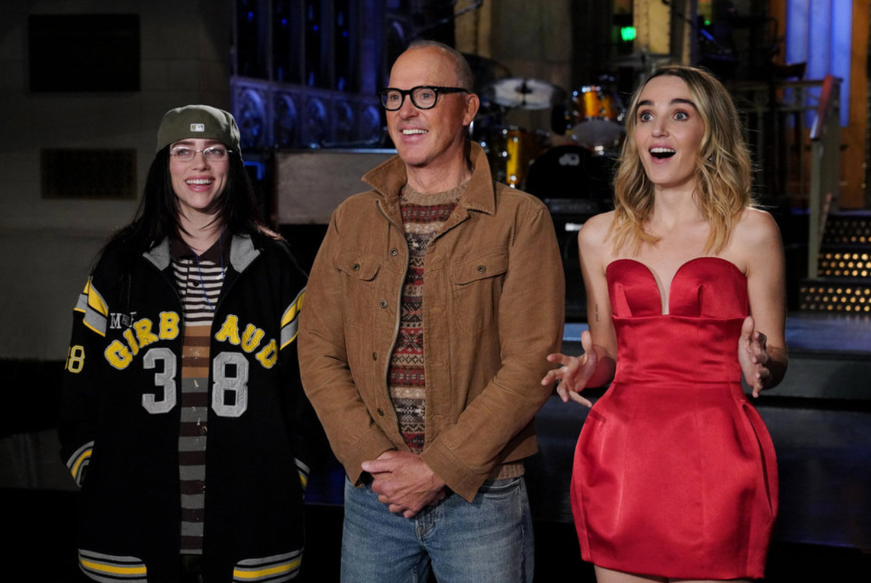 Image may contain Michael Keaton Billie Eilish Adult Person Clothing Coat Jacket Fashion Dress Pants and Blazer