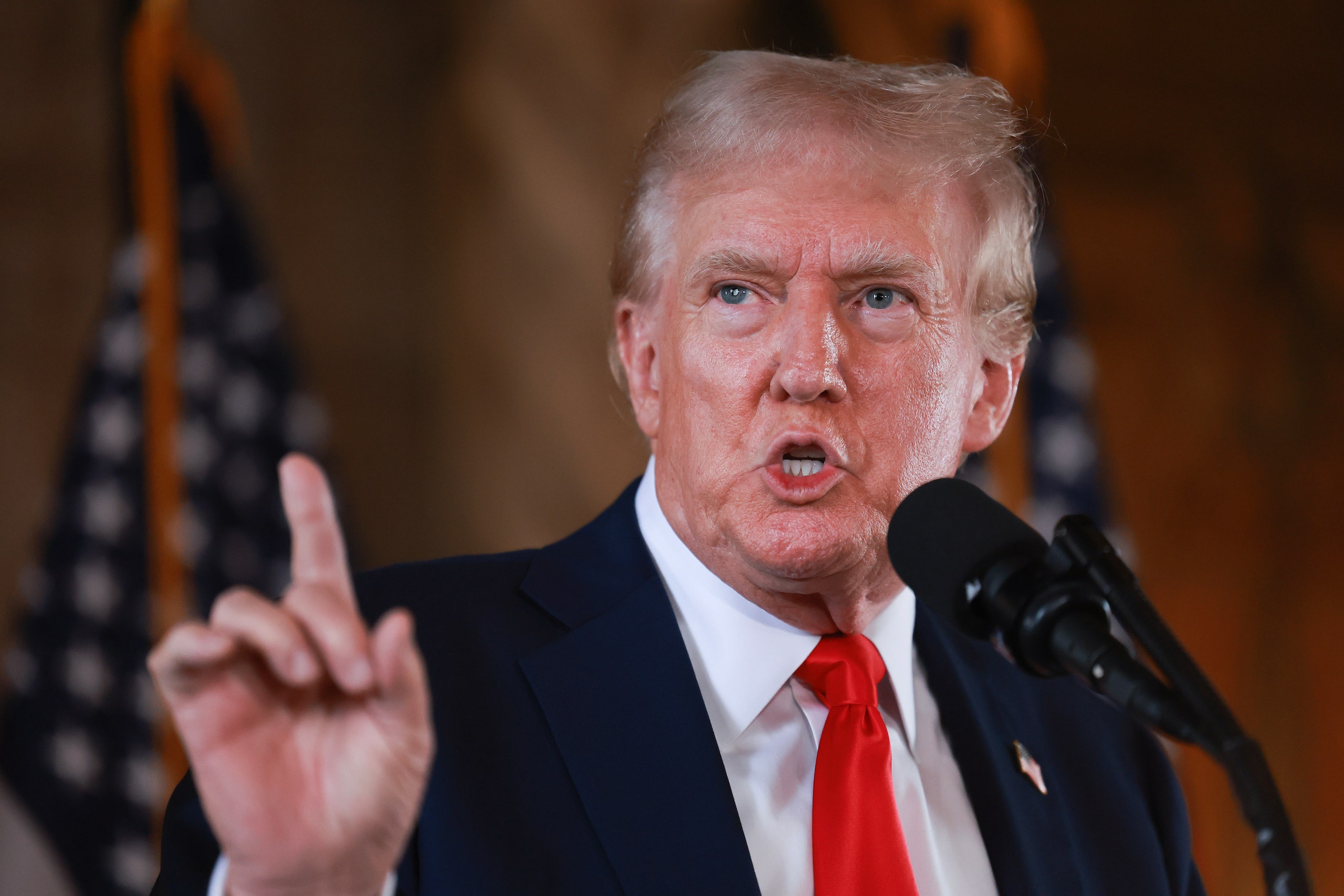 Image may contain Donald Trump People Person Crowd Press Conference Accessories Formal Wear and Tie