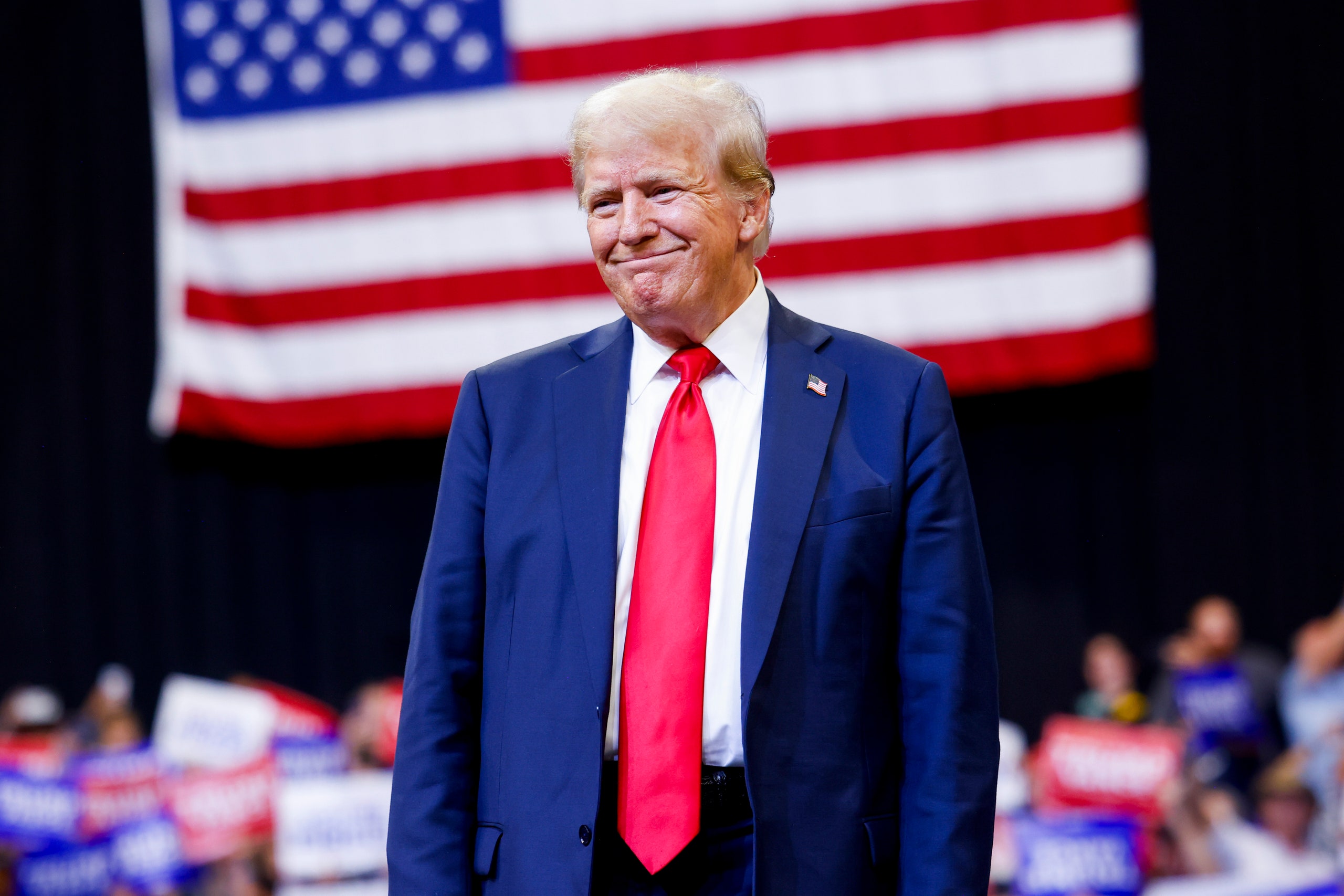 Image may contain Donald Trump Accessories Formal Wear Tie People Person Adult Flag Crowd and American Flag