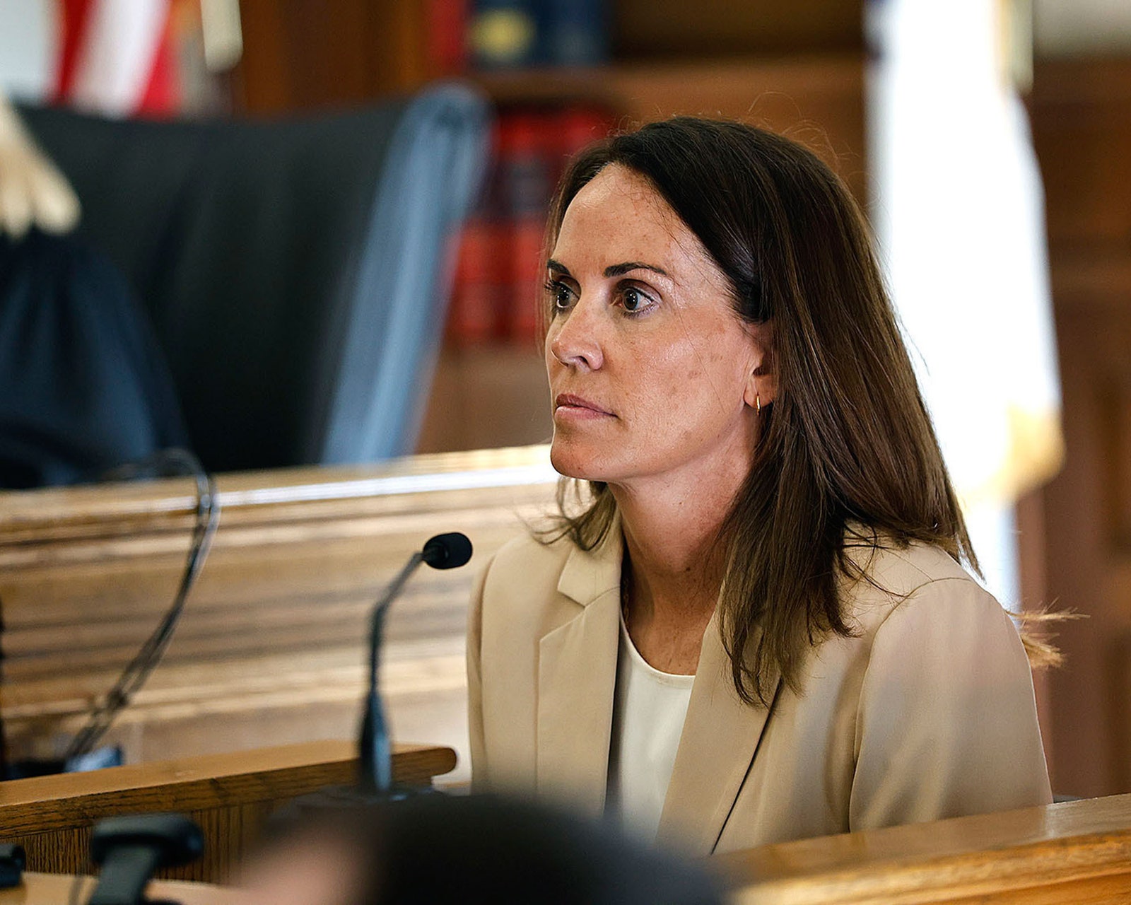 Image may contain Janine Allis Adult Person Electrical Device Microphone Chair Furniture and Indoors