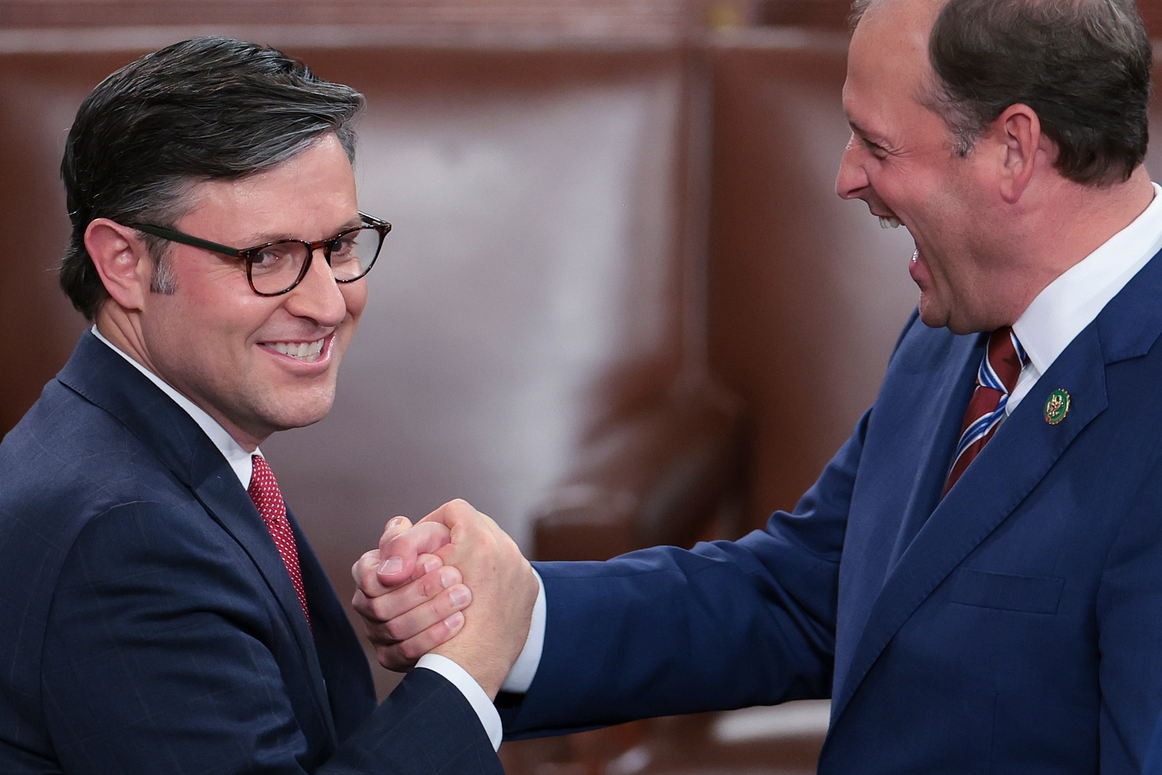 Image may contain Andy Barr Accessories Formal Wear Tie Glasses Adult Person Body Part Hand and Holding Hands