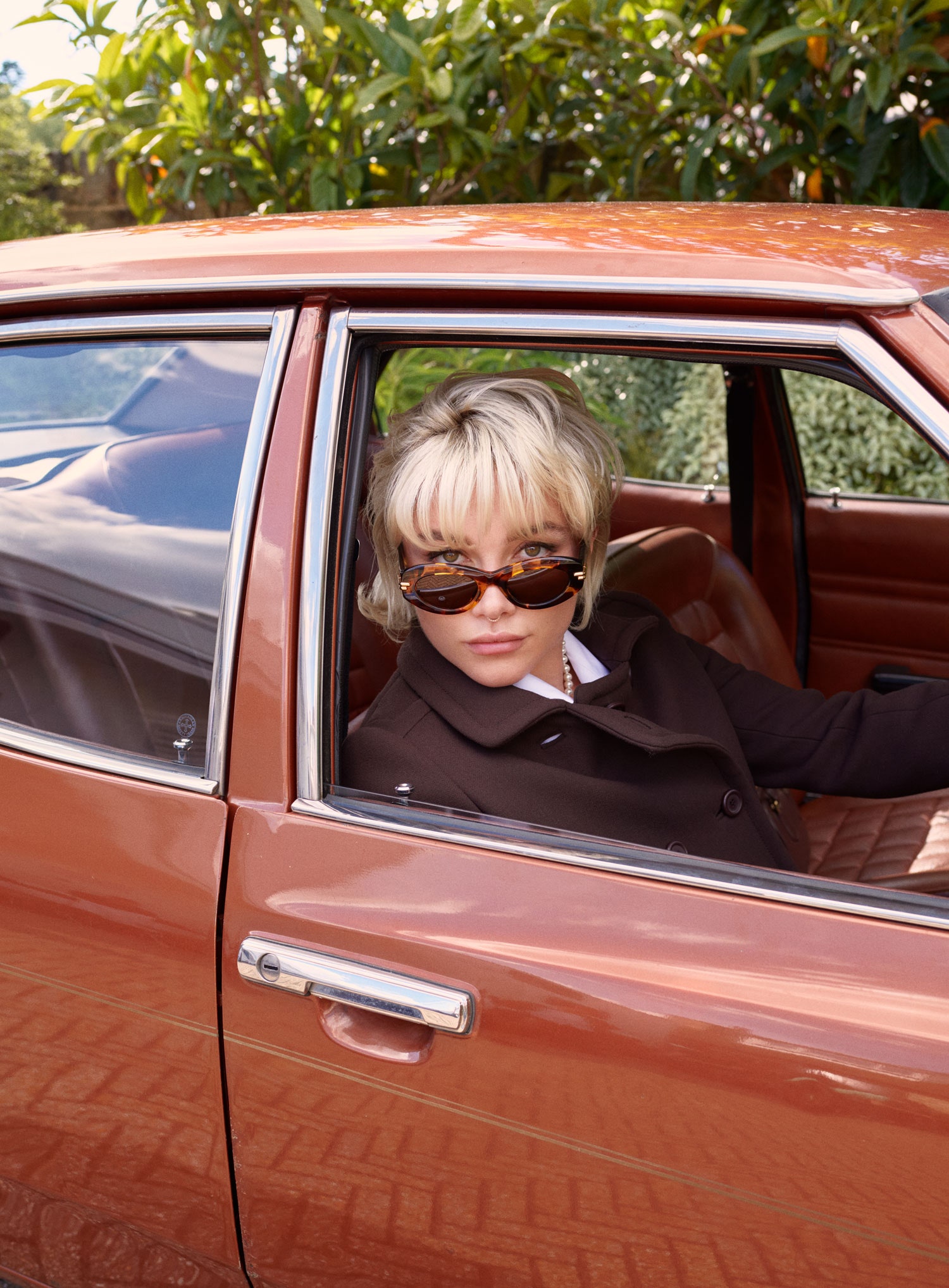 Image may contain Accessories Glasses Face Head Person Photography Portrait Sunglasses Car and Transportation