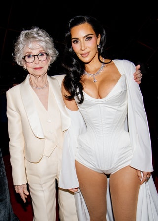 Image may contain Kim Kardashian Rita Moreno Fashion Accessories Glasses Blazer Clothing Coat Jacket and Jewelry