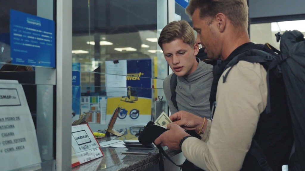 Celebrity Race Across The World Jeff Brazier and son Freddy buying a bus ticket in Argentina
