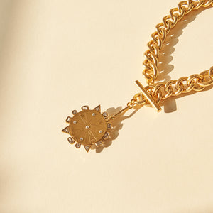 Compass Charm Chain Pendant Necklace Styled on Tan Background with Shadows