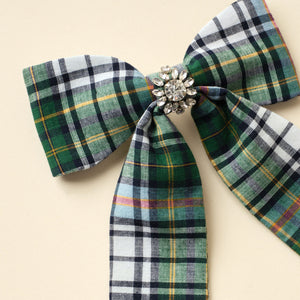 Green Plaid Hair Bow with Crystals on Tan Background