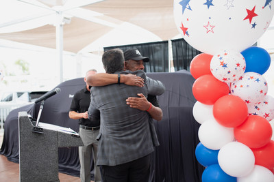 Lance Corporal Len Johnson with TrueCar CEO Mike Darrow.