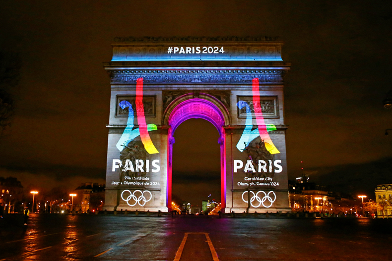 The Eiffel Tower-shaped bid logo for the Paris 2024 is unveiled on The Arc of Triomphe on the Champs Elysees in Paris, France, Tuesday, Feb. 9, 2016. Leaders of the Paris bid for the 2024 Olympics boosted their public campaign on Tuesday as they secured about 8 million euros ($8.9 million) in sponsorship deals with four major French groups. (AP Photo/Francois Mori)