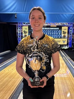 Sara Duque holds her 2024 Intercollegiate Singles Championship trophy