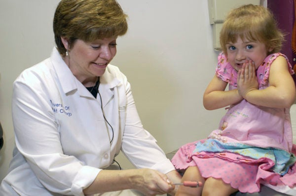 School nurse with child patient