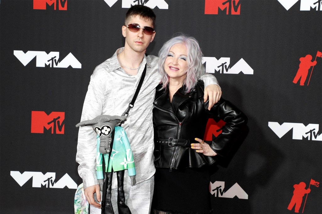 Photo of Declyn Lauper posing his mom, Cyndi Lauper.