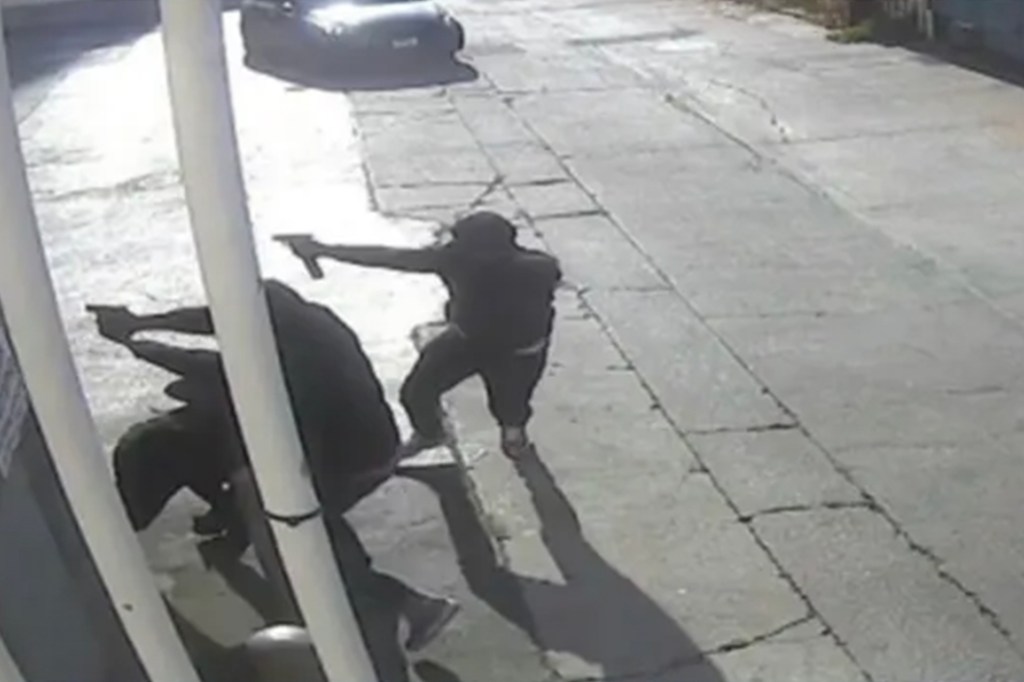 Surveillance video of several men allegedly firing shots at a black Cadillac Escalade at a Los Angeles gas station, linked to the murder-for-hire conspiracy case involving rapper Quando Rondo