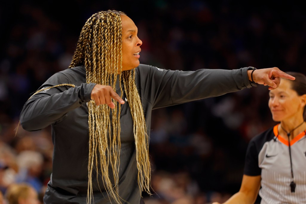 Chicago Sky head coach Teresa Weatherspoon, left, directs her team as they play the Minnesota Lynx in the second quarter of a WNBA basketball game Friday, Sept. 13, 2024, in Minneapolis. 