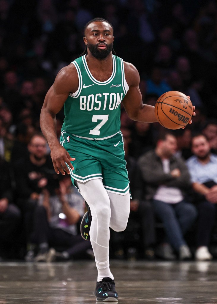 Celtics guard Jaylen Brown (7) dribbles up court during the first half against the Brooklyn Nets at Barclays Center on Nov. 13, 2024. 