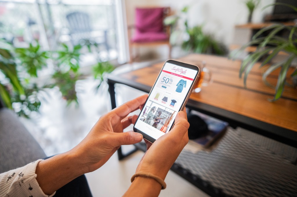 A close-up of a woman shopping online