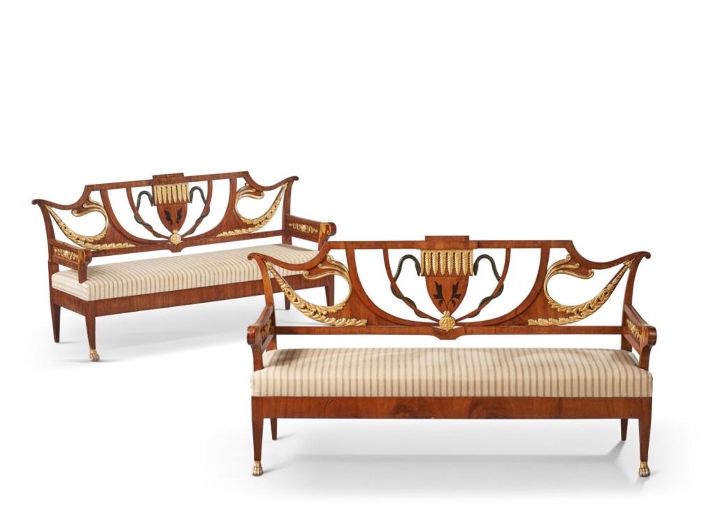 A pair of Biedermeier mahogany, ebonized and parcel-gilt settees from 19th century south Germany set to fetch up to $8,000.  