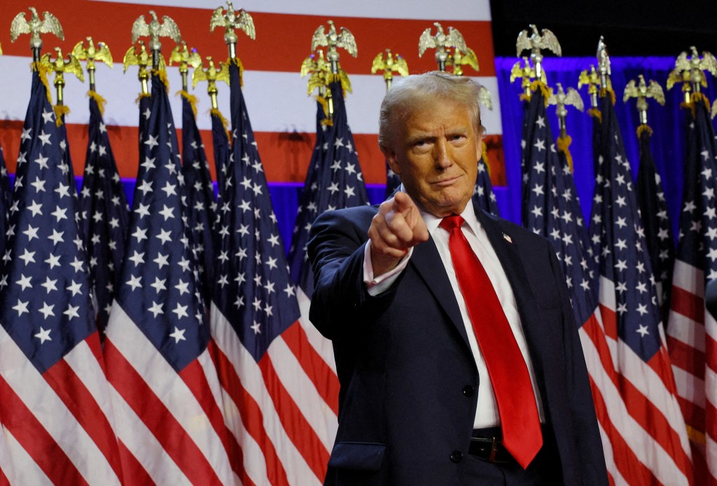 Republican presidential nominee and former U.S. President Donald Trump takes the stage to address supporters at his rally, at the Palm Beach County Convention Center in West Palm Beach, Florida, U.S., November 6, 2024. 