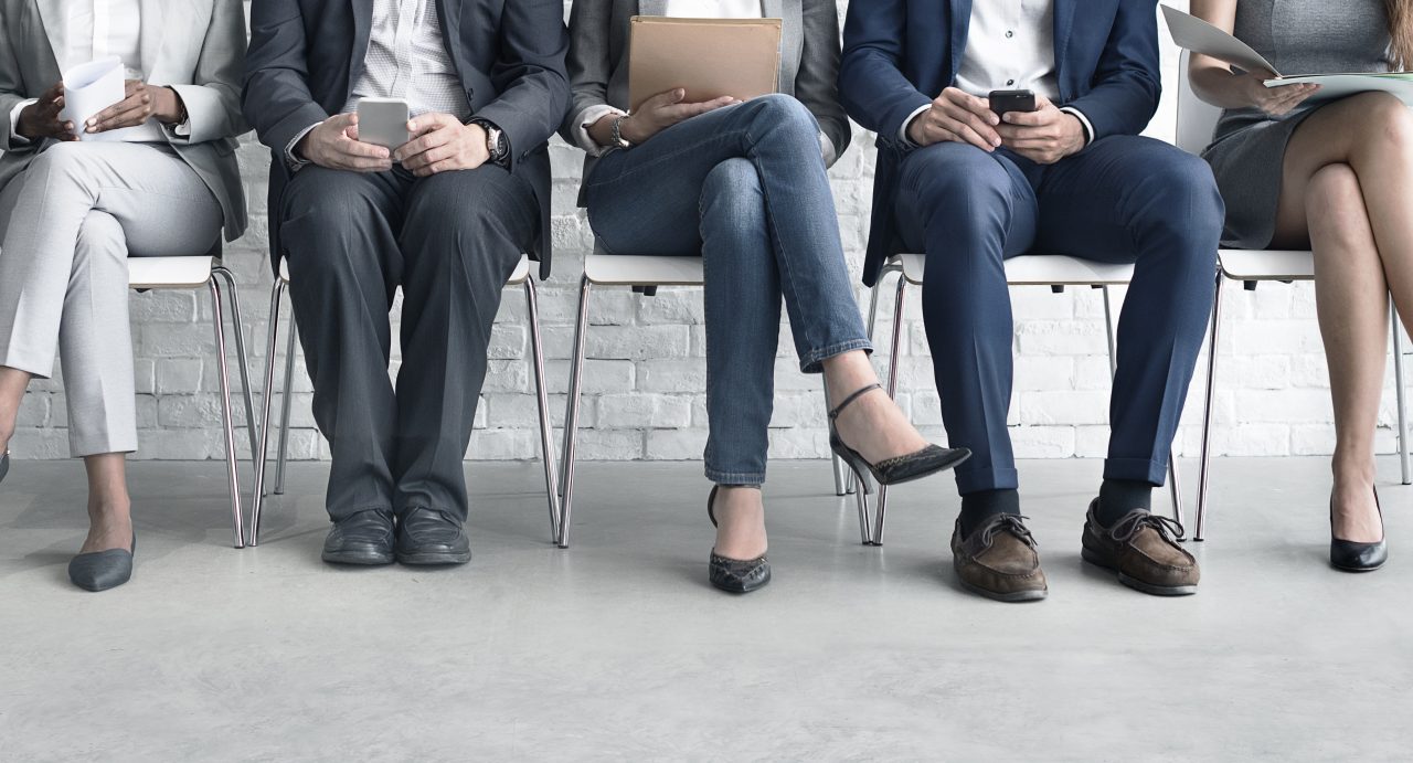 people sitting waiting for an interview