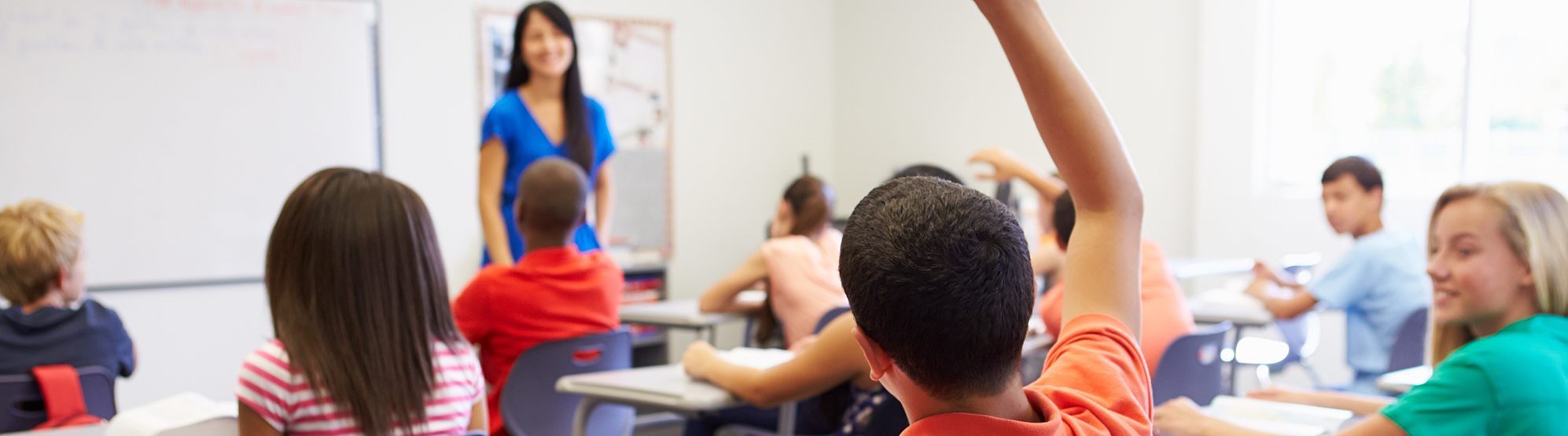 Students engaging with teacher in the classroom