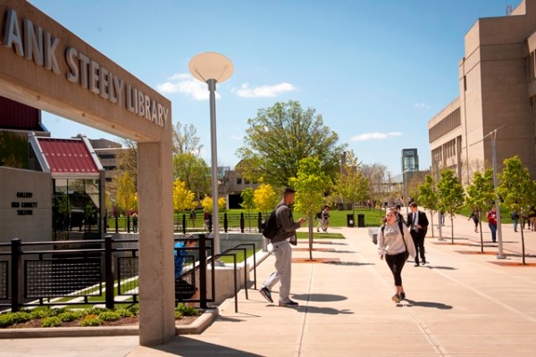 Student walking toward library