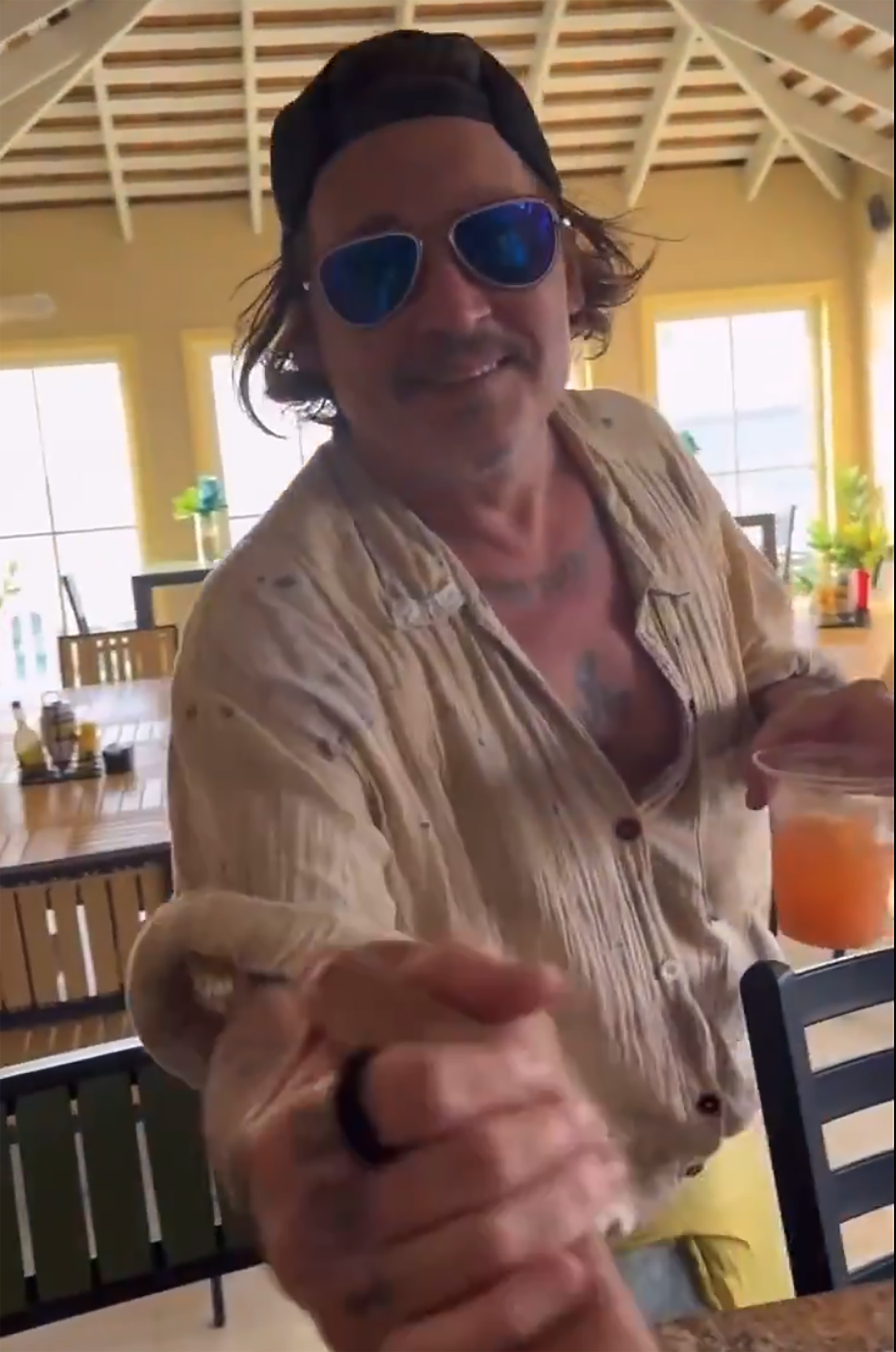 Johnny Depp smiling in recent Instagram video taken in the Bahamas